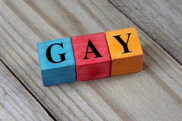word gay on colorful wooden cubes