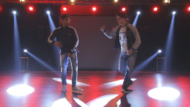 Hip-hop dancers  dances on stage in the club