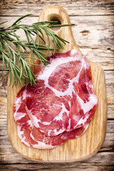 Dried pig meat slices. Delicatess.