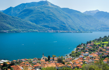 Naklejka na ściany i meble Colorful image of Lake Como and its blue water on a sunny day