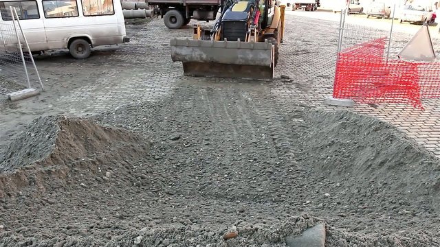 Excavator transports gravel