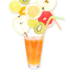 Fresh fruit juice in glass and ripe fruits. Isolated on white