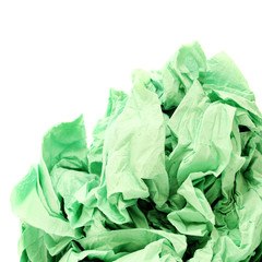 Green crumpled toilet paper on white