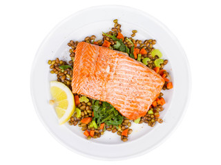 Salmon with Lentils and Arugula in Plate Isolated on White