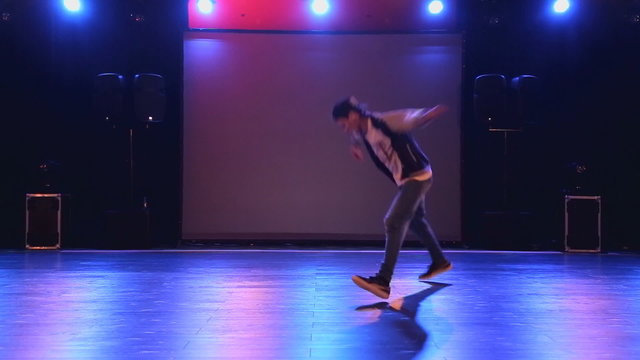 Hip-hop dancer  dances on stage in the club