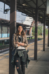 Pretty girl posing in a metro station