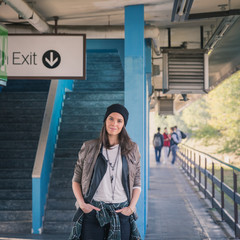 Pretty girl posing in a metro station