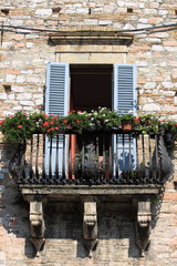 Fototapeta na wymiar Medieval balcony with flower pots