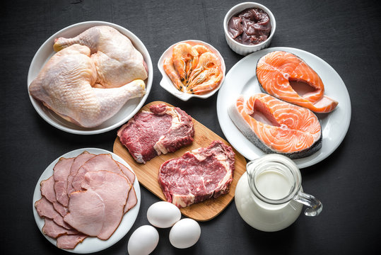 Protein diet: raw products on the wooden background