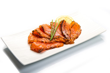smoked salmon on white dish with chive