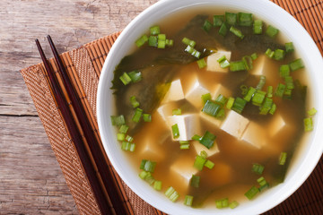 classic miso soup in a white bowl close-up horizontal top view © FomaA