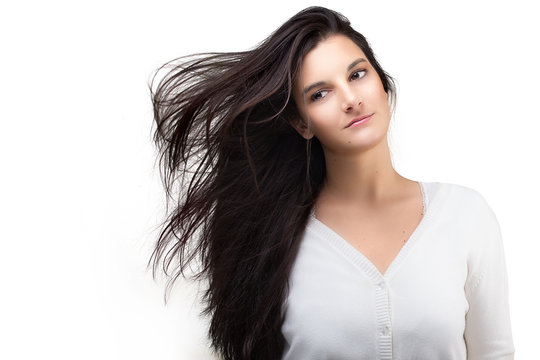Beautiful Young Woman with Air Blown Hair. Healthy Long Hair