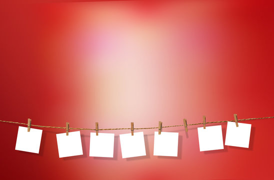 Clothesline with white notes on red background