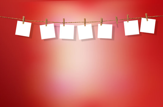 Clothesline with white notes on red background