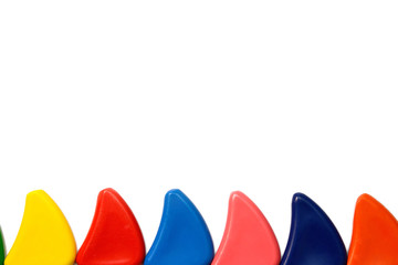 fence of pencils crayons on white