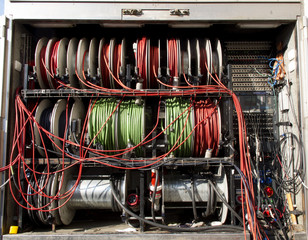 Wide shot of vision mixing panel in a television gallery.