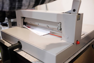 Guillotine paper cutter on white background