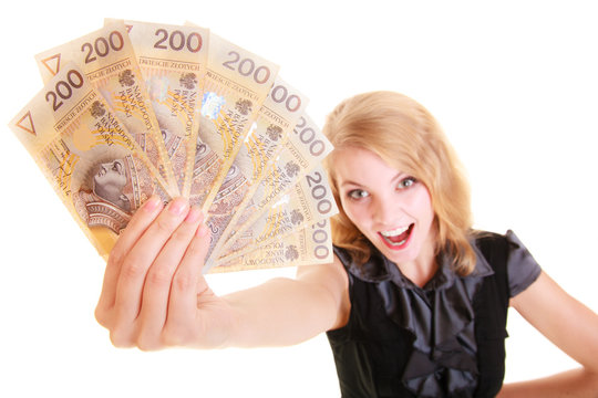 Business woman holding polish currency money banknote.