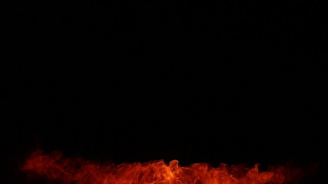 Fire show artist breathe fire in the dark
