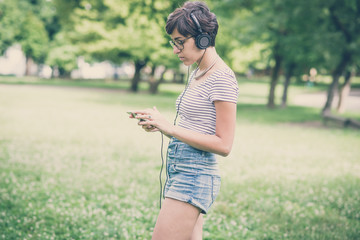 young hipster woman listening to music