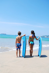 Boy and girl with boards