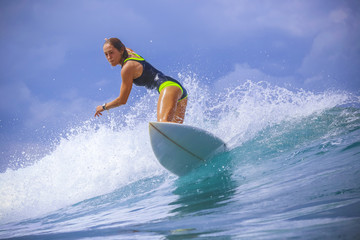 Surfer girl on Amazing Blue Wave - 76865187