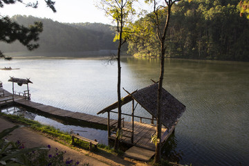 Hut and wooden bridge on Pang Oung lake, Thailand