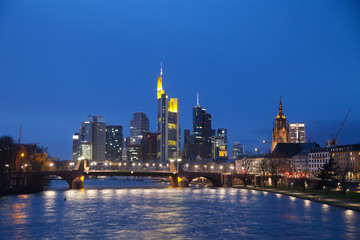 The view of Frankfurt's skyscrapers at dusk time from bridge