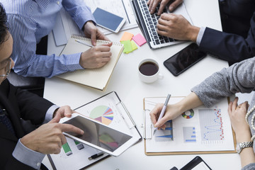 Men have a meeting using the electronic tablet