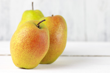 Pears on white wood
