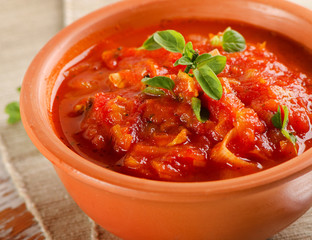 delicious minestrone soup in a clay bowl