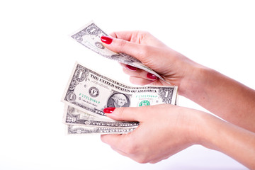 Woman hands holding banknotes of dollars