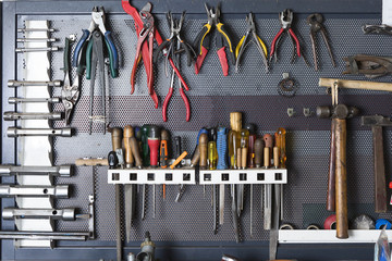 tools on a metal board .