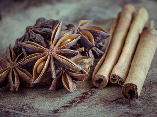 cinnamon sticks and star anise on  wood background