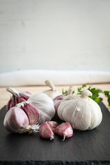 Composition of purple garlic with parsley