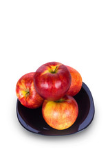 Red apples on a plate