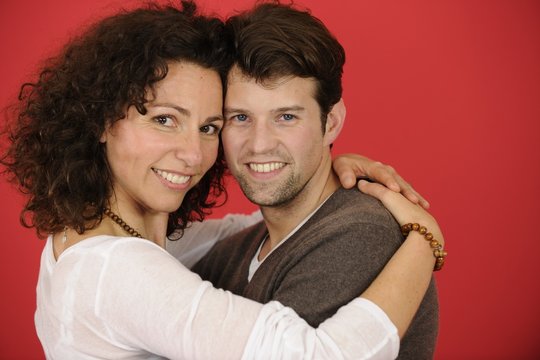 happy couple on red background