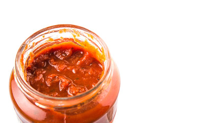 Spaghetti sauce in a jar over white background