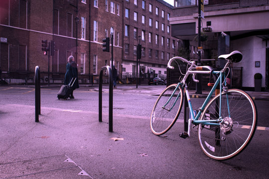 Old Bycicle On The Steet Of Citty