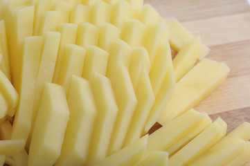 cut julienne potatoes on a cutting board