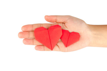 Obraz premium female hand holding paper heart