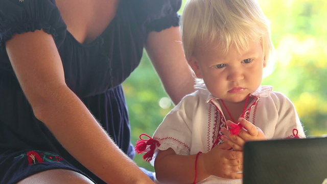 small blonde baby girl in ukrainian national dress vyshyvanka