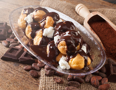 Chocolate profitteroles with cream