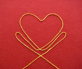 Valentines day card - heart made from wire on red background