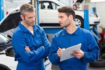 Team of mechanics talking together