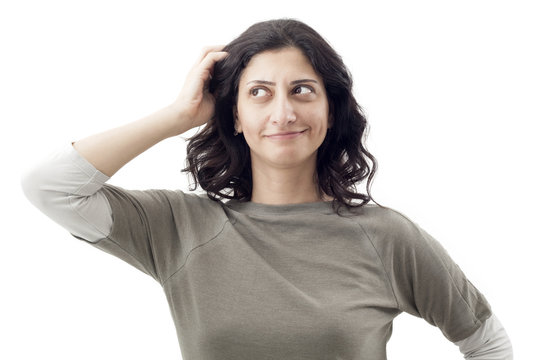 Young woman scratching her head