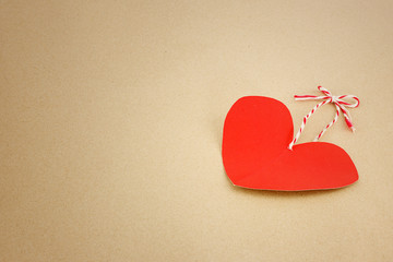 Fototapeta premium Red heart on brown as valentines background