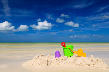 Fototapeta na wymiar kids toys on sand beach