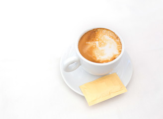 one white cup of Cappuccino coffee with heart shaped milk foam