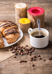 Fototapeta na wymiar Breakfast with coffee and croissants on wooden table